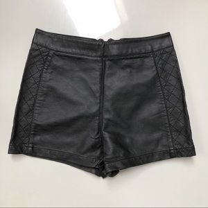 F21 Black faux leather side quilted shorts